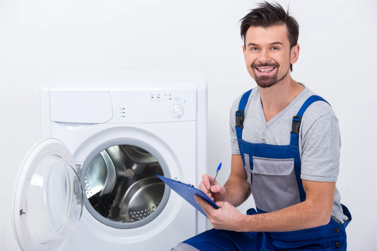 repairman is repairing washing machine